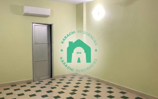 Bright yellow bedroom with AC and grey door - Garden East 3 bed apartment