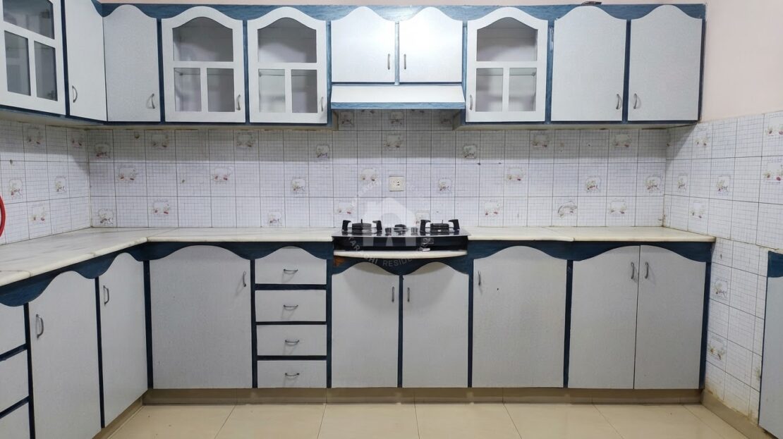 Kitchen with stove and storage cabinets, Soldier Bazar flat