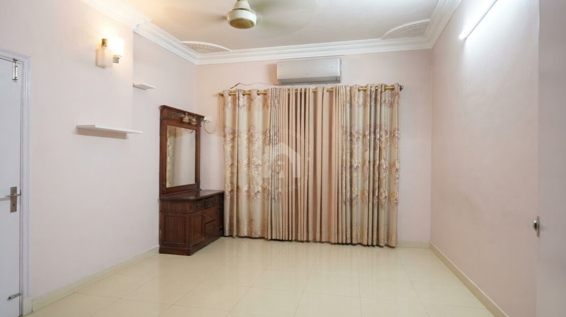 Primary bedroom with double bed and air conditioner, Soldier Bazar flat