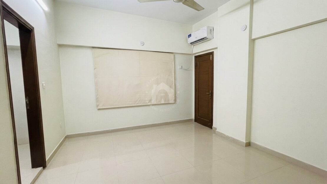 Bedroom with roller blind and air conditioning in PECHS Block 2 furnished apartment, Karachi Residencies