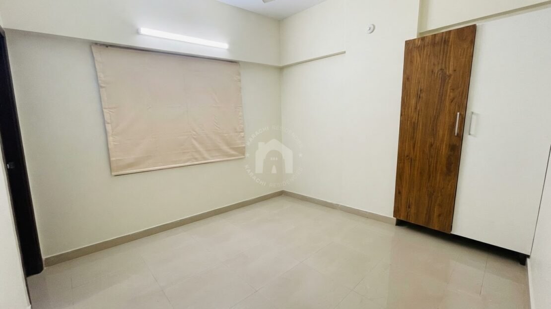 Living and dining area with open kitchen in PECHS Block 2 furnished apartment, Karachi Residencies