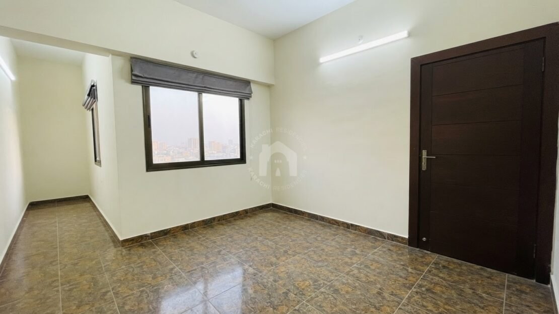 Bedroom with window and city view in PECHS Block 2 furnished apartment, Karachi Residencies